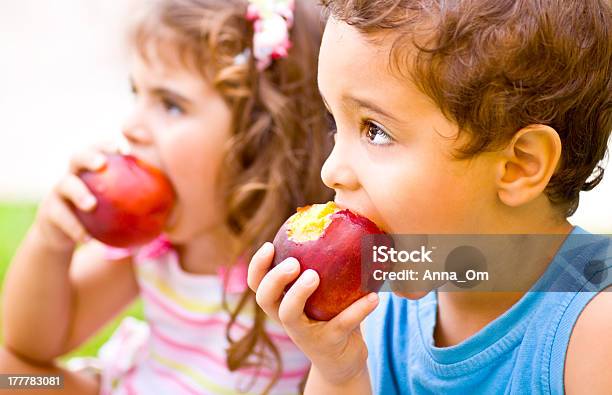 Happy Children Eating Apple Stock Photo - Download Image Now - Apple - Fruit, Eating, Child