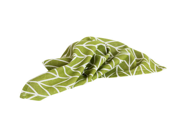 istock Green textile napkin isolated on white background. Folded decorative kitchen cotton towel. Top view 1777831010