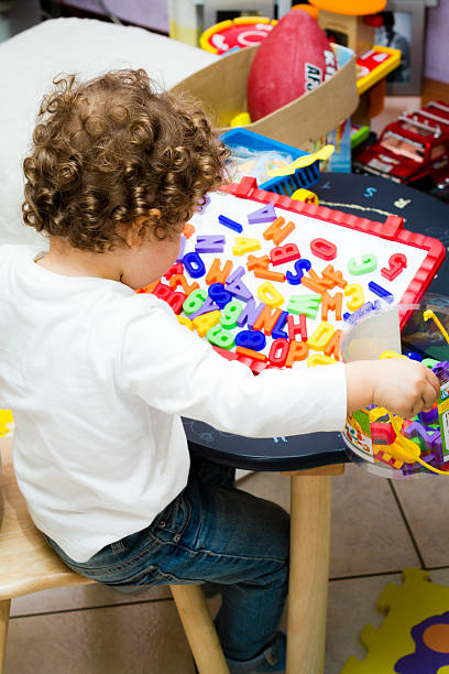 istock Toddler (2 years old) plays with toy letters 177783168