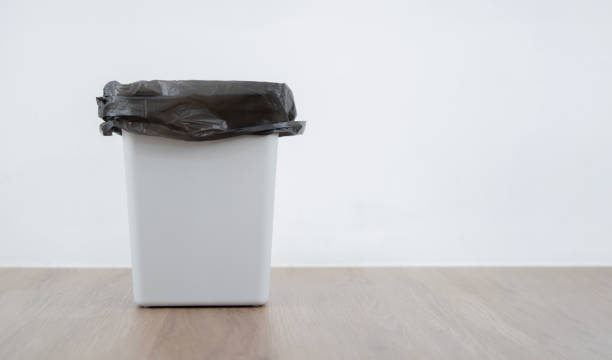 Rubbish bin side view. Empty Garbage Bin Banner.  Waste Bin on wooden flool with white background.