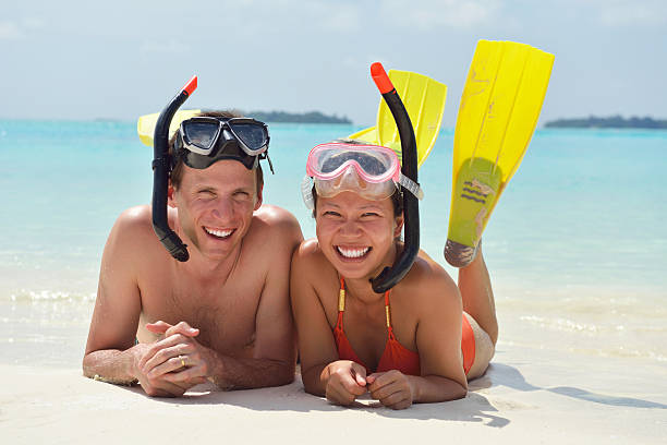 istock happy young couple have fun on beach 177783819
