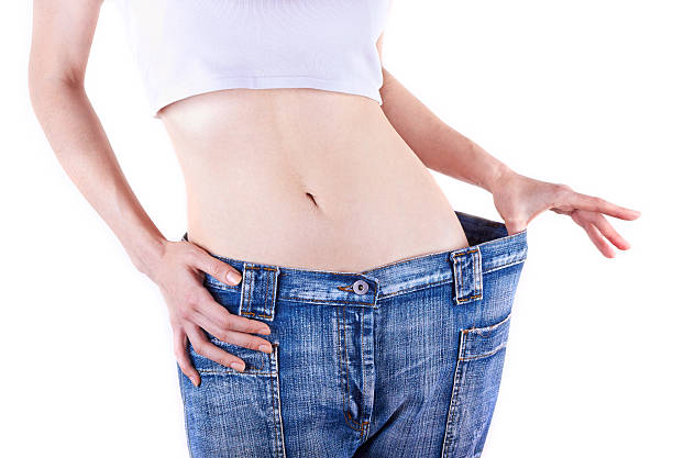 istock Slim woman shows her weight loss 177783830