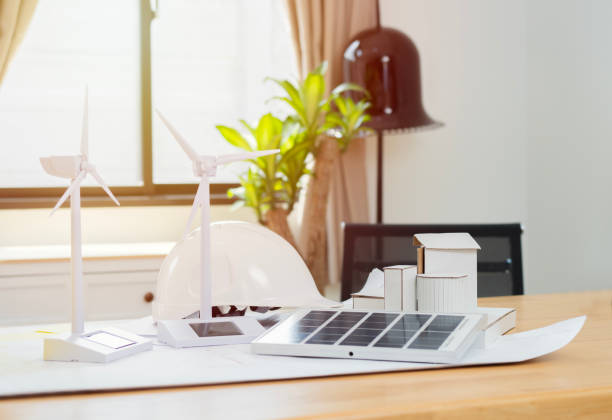 istock Empty green power engineering design studio office for copy space, windmill on wooden desk. 1777838411