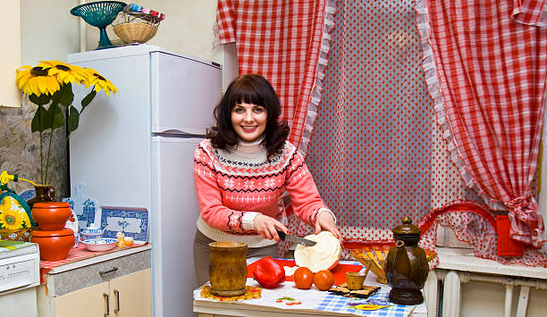 istock Woman in kitchen cooking 177784037
