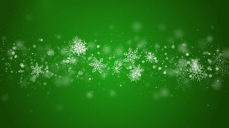 Green Christmas holiday background with graphic swirling white snowflakes and blurred particles. Looped animation.