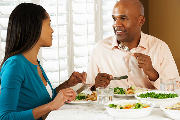 istock Couple Enjoying Meal At Home 177784288
