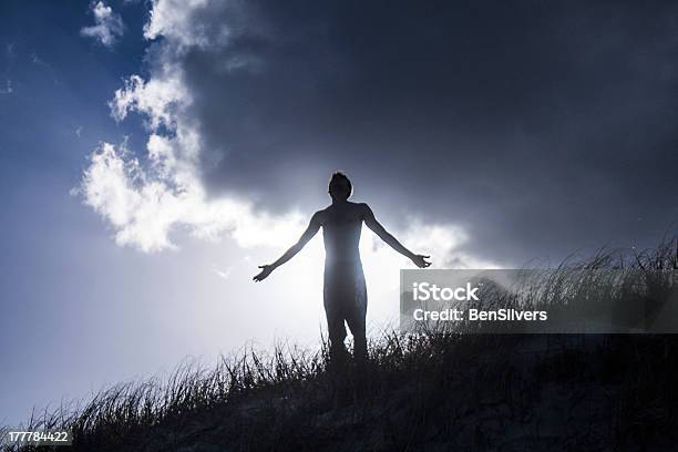 Man Looking Up With Open Arms Stock Photo - Download Image Now - Beach, Men, Praying