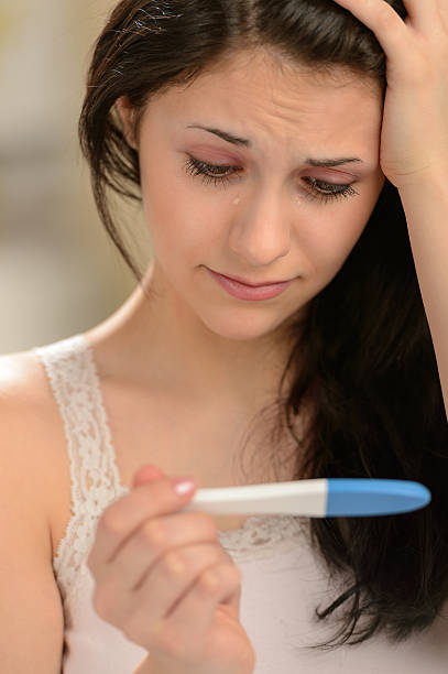 istock Distraught girl waiting for pregnancy test result 177784483