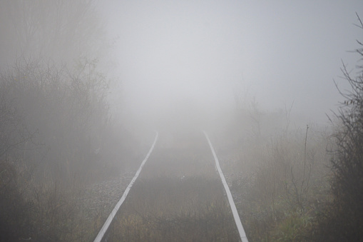 Rail transport, autumn, fog, reduced visibility.