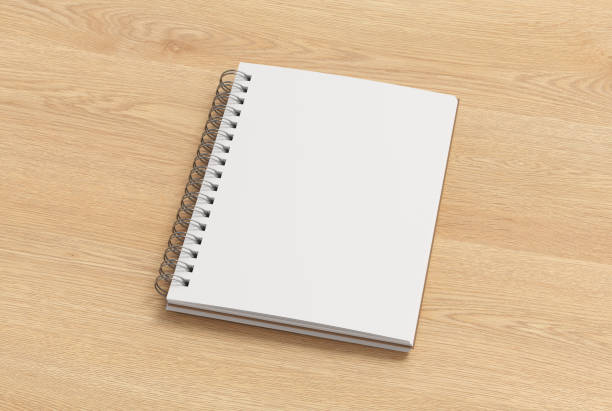 istock Notebook mockup. Opened blank notebook with craft paper cover. Spiral notepad on wooden background 1777850477