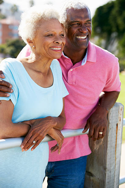 istock Senior Couple Walking In Park Together 177785835