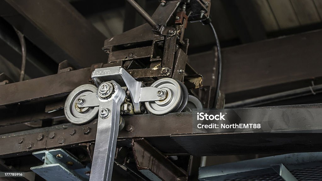 Mechanical pulley system, old factory roof Mechanical pulley system, from old factory roof Factory Stock Photo