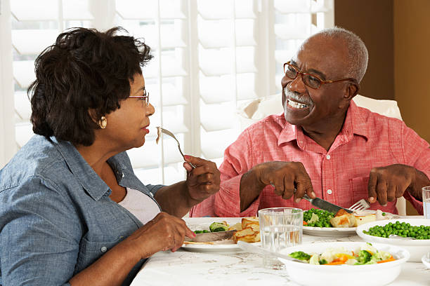 istock Senior Couple Enjoying Meal At Home 177786074