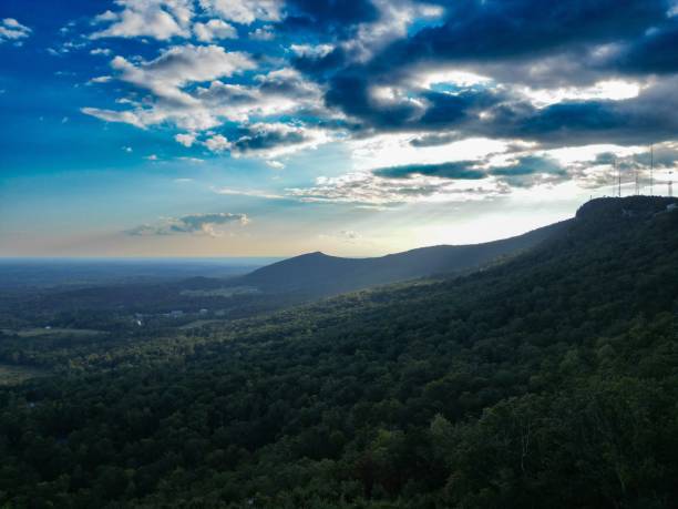 istock the sun shining on a mountain with trees in the foreground 1777862474