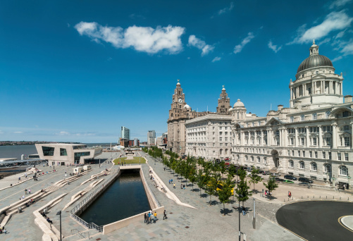 Liverpool city skyline, waterfront and the three graces (The Royal Liver, the Cunard and the Port of Liverpool Buildings) on the River Mersey in North West England, UK.