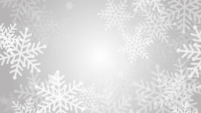 Large white graphic drawn snowflakes swirl on gray winter background. Looped festive fun animation. Copy space.