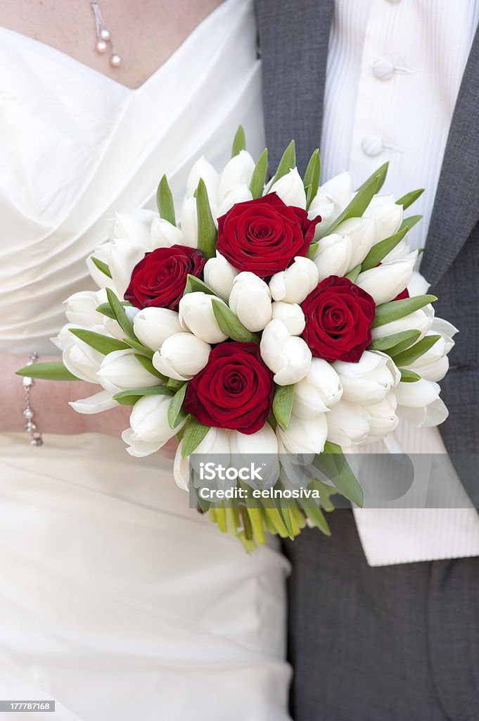 red rose and white tulip wedding bouquet bride holding red rose and white tulip wedding bouquet Adult Stock Photo