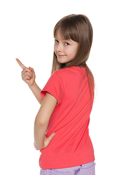 istock Young girl shows her finger to the side left 177787826