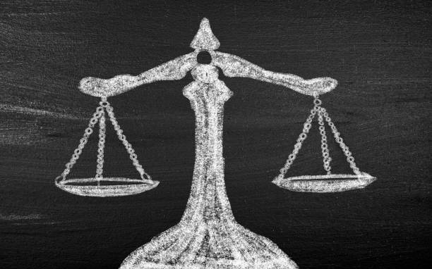 istock Scales of justice on chalkboard 1777881349