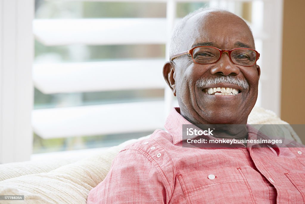Portrait Of Happy Senior Man At Home Portrait Of Happy Senior Man At Home Looking At Camera Smiling Senior Adult Stock Photo