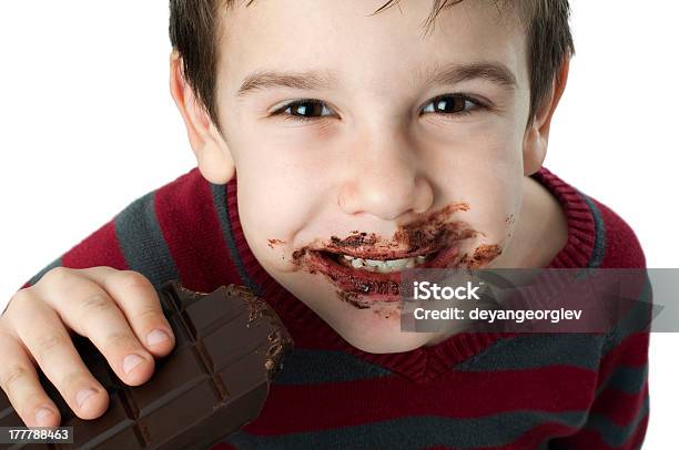 Smiling Little Boy Eating Chocolate Stock Photo - Download Image Now - Addiction, Antioxidant, Black Color