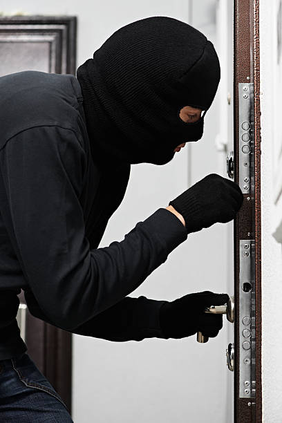 istock burglar thief at house breaking 177789215