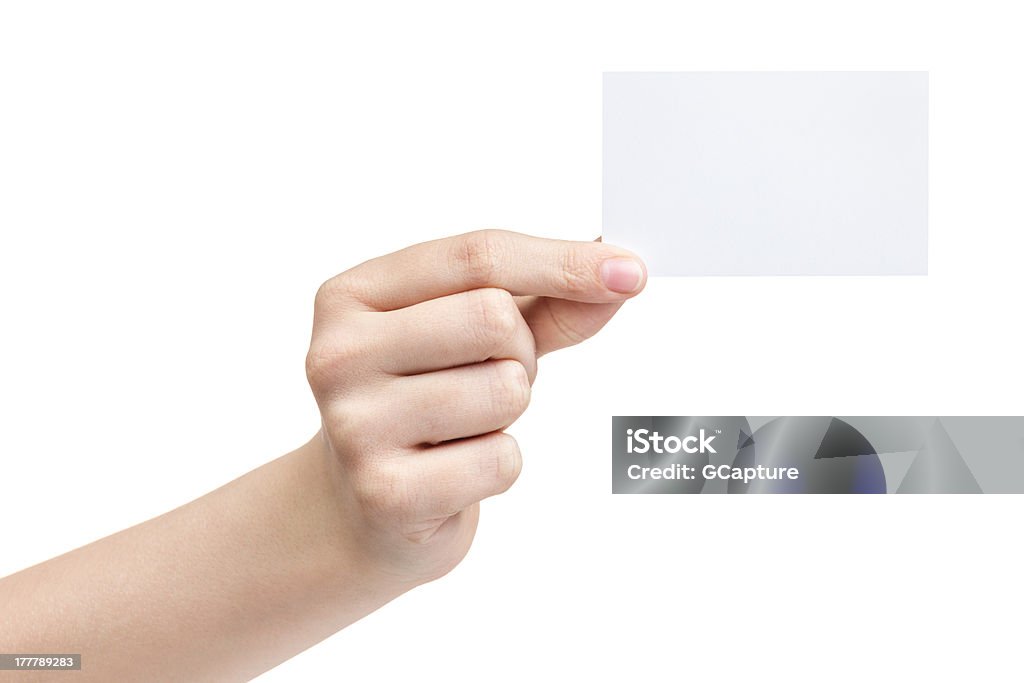 female teen hand holding blank paper card with two fingers female teen hand holding blank paper card with two fingers, isolated on white Adult Stock Photo