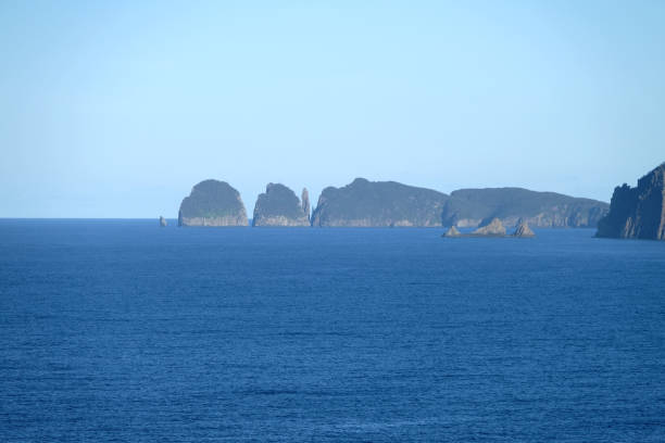 View of Cape Hauy, a stunning cape at the edge of Tasman Peninsula with spectacular dolerite columns. It is part of Tasman National Park, Tasmania, Australia.