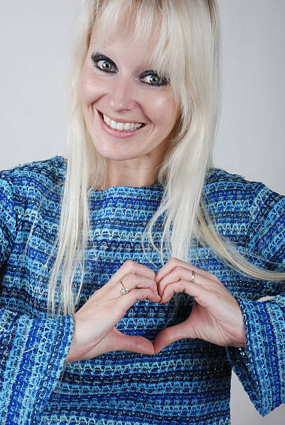 istock Woman making heart shape with her hands 177789371