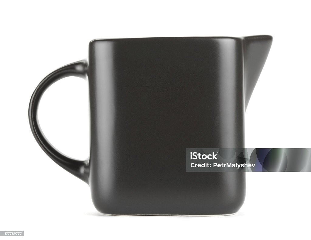 Milk Jug empty quadratic pitcher jug for milk isolated on white Black Color Stock Photo