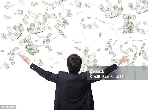 Businessman Stands With Arms Out As Money Falls Stock Photo - Download Image Now - Currency, Rain, Men