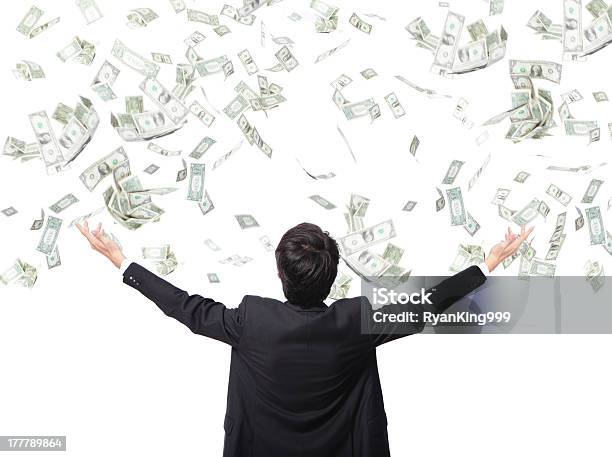 Businessman Stands With Arms Out As Money Falls Stock Photo - Download Image Now - Currency, Rain, Falling