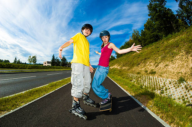 A man rollerblading has fallen on the lane.