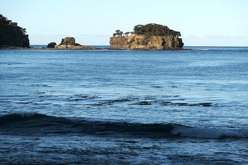 Small rocky island off Pirate Bay in Eaglehawk Neck, on the Tasman Peninsula of Tasmania.