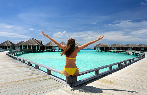 istock Woman on a beach jetty at Maldives 177791185