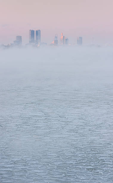istock Skyscrapers in mist behind frozen water 177791337