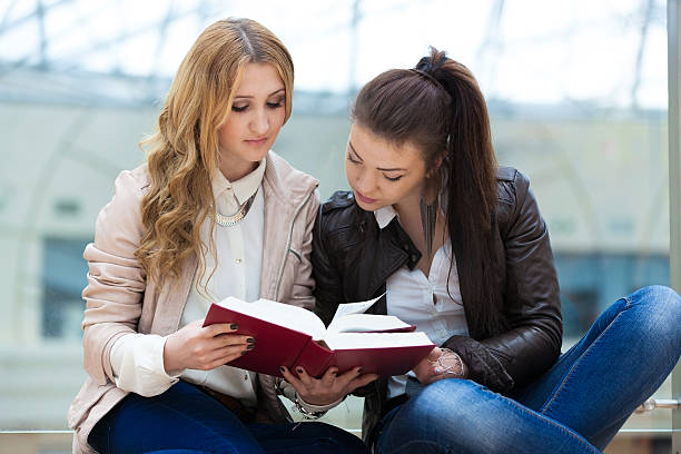 istock two girls with books 177791423
