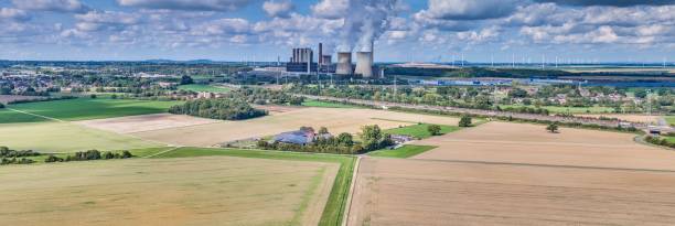 istock Panoramic picture of a coal-fired power station with smoking chimneys 1777918328
