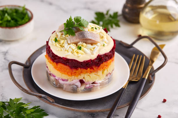 istock Herring under a fur coat. Layered salad with herring fish, boiled eggs and vegetables: potato, carrot and beetroot. 1777920026