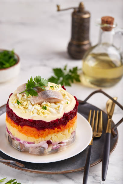 istock Herring under a fur coat. Layered salad with herring fish, boiled eggs and vegetables: potato, carrot and beetroot. 1777920027