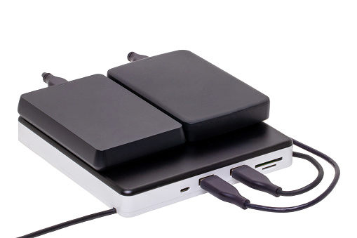 External DVD CD usb burner drive and player with integrated USB interfaces (two connected with hard drives), SD TF and micro connections. Clipping path. Computer accessories.