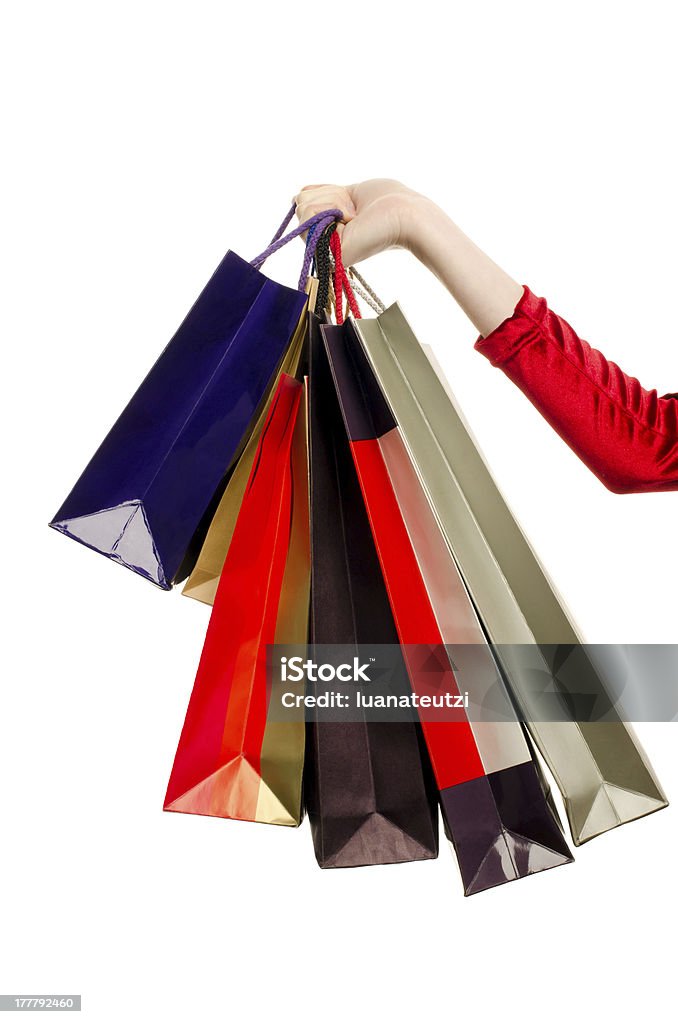 Mano de mujer sosteniendo bolsas de la compra. - Foto de stock de Adicto a las compras libre de derechos