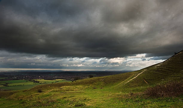 istock Stormy dramatic cloud formations in sky above countryside landscape 177792783