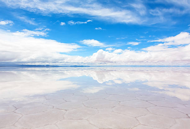 Hexagonal shape pattern on thin layer Lake Salar de Uyuni "Panorama of the reflecting surface of the lake Salar de Uyuni, Bolivia" salar de uyuni stock pictures, royalty-free photos & images