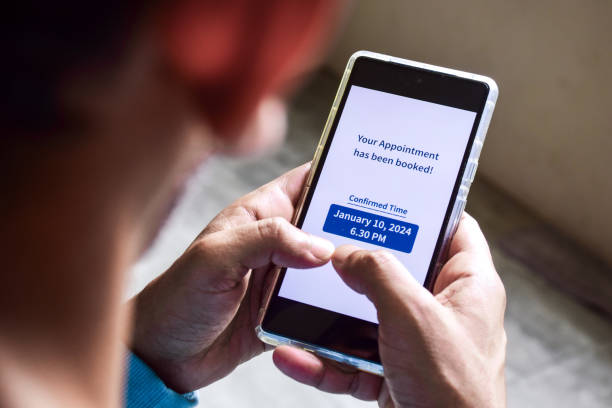 istock A South Asian man checking smartphone notification for his upcoming appointment. Online appointment booking and scheduling concept. 1777934224