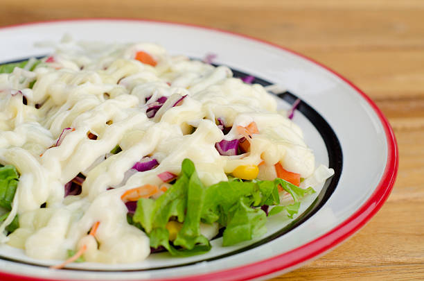 Fresh vegetable salad dressed with mayonnaise