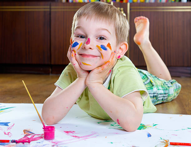 istock Excited little boy painting 177793573