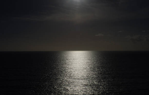 istock Shining sun leaves a path of reflections on the calm sea. 1777941942
