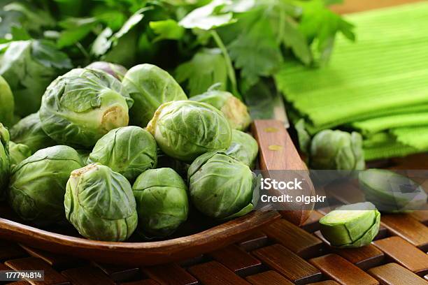 Fresh Raw Brussels Sprouts On A Wooden Table Stock Photo - Download Image Now - Agriculture, Brussels Sprout, Cabbage