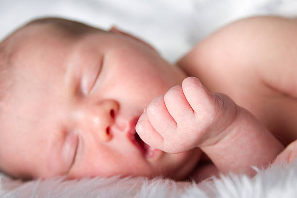 Close up of newborn babys hand stock photo